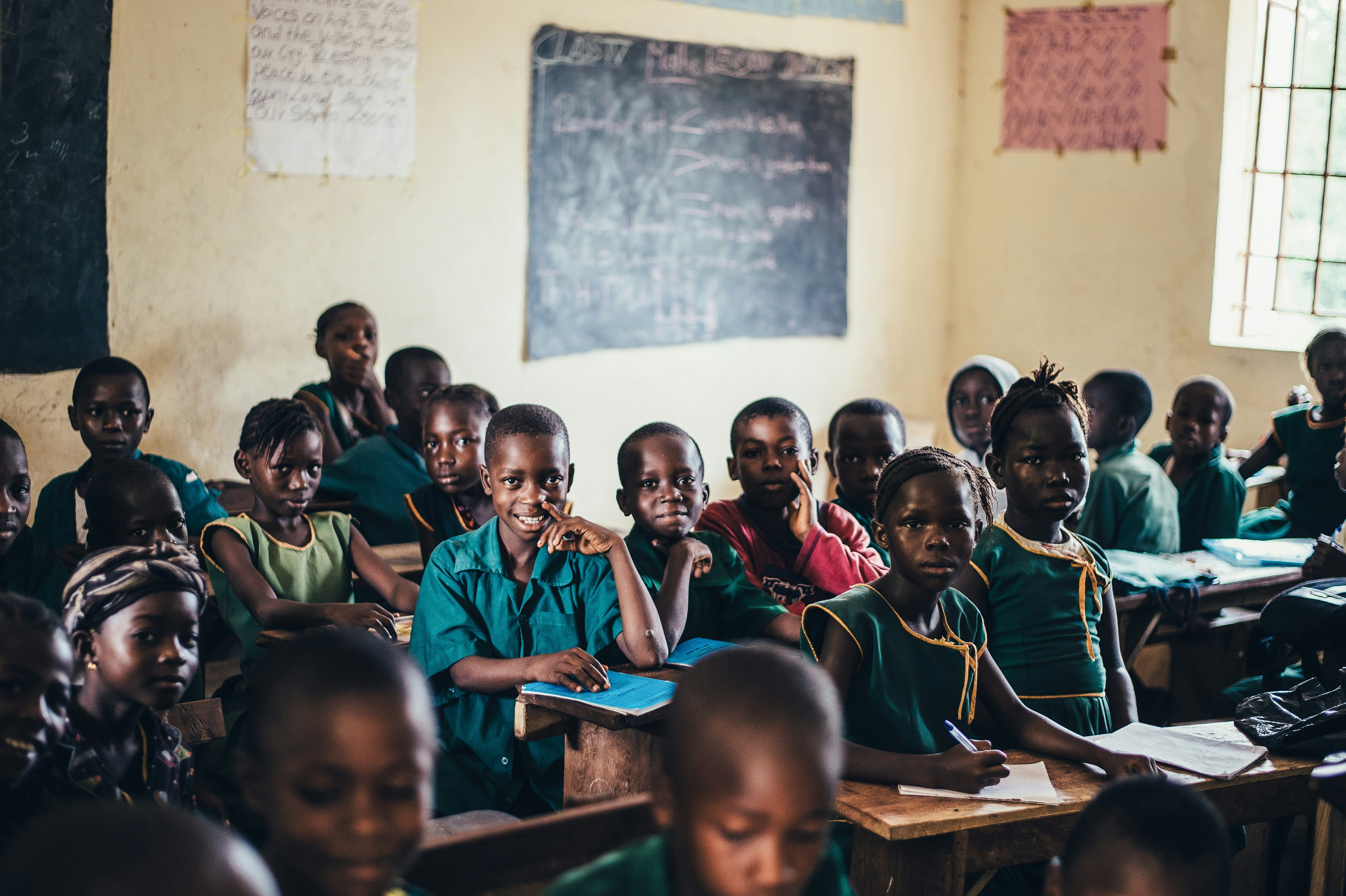 Students writing in classroom